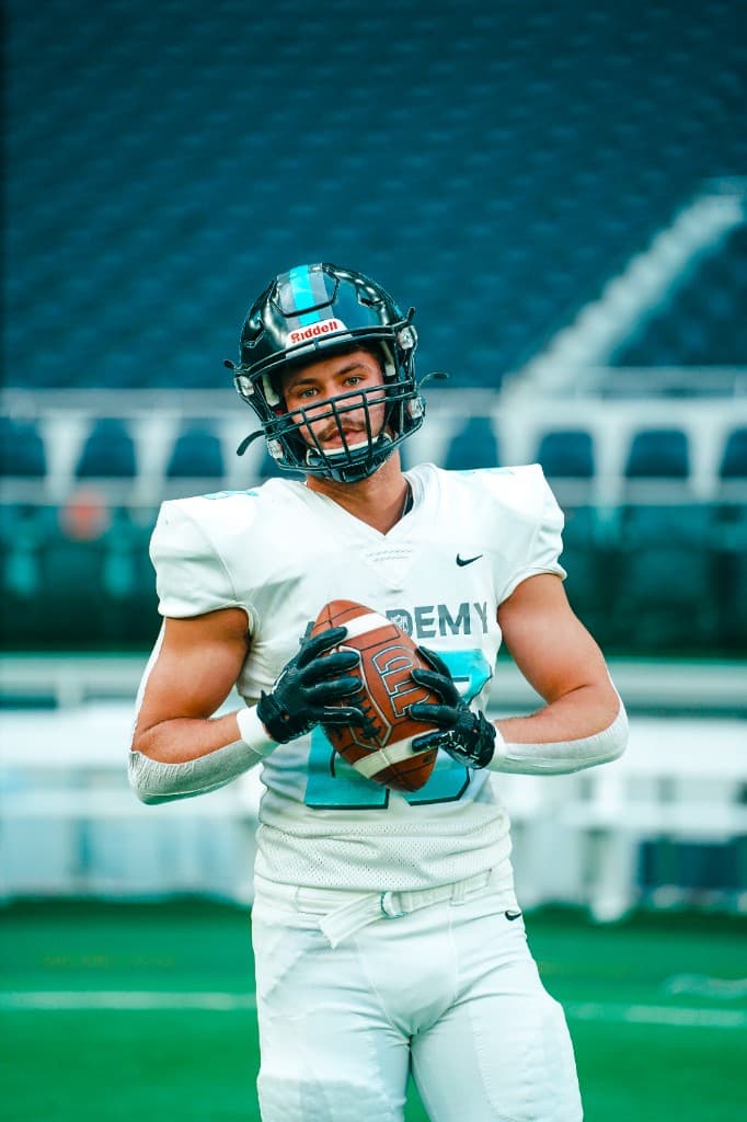 Adrian in American football uniform on the field